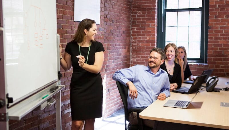 woman giving presentation in meeting